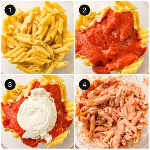 Cooked ziti tossed with marinara sauce and ricotta in a large bowl