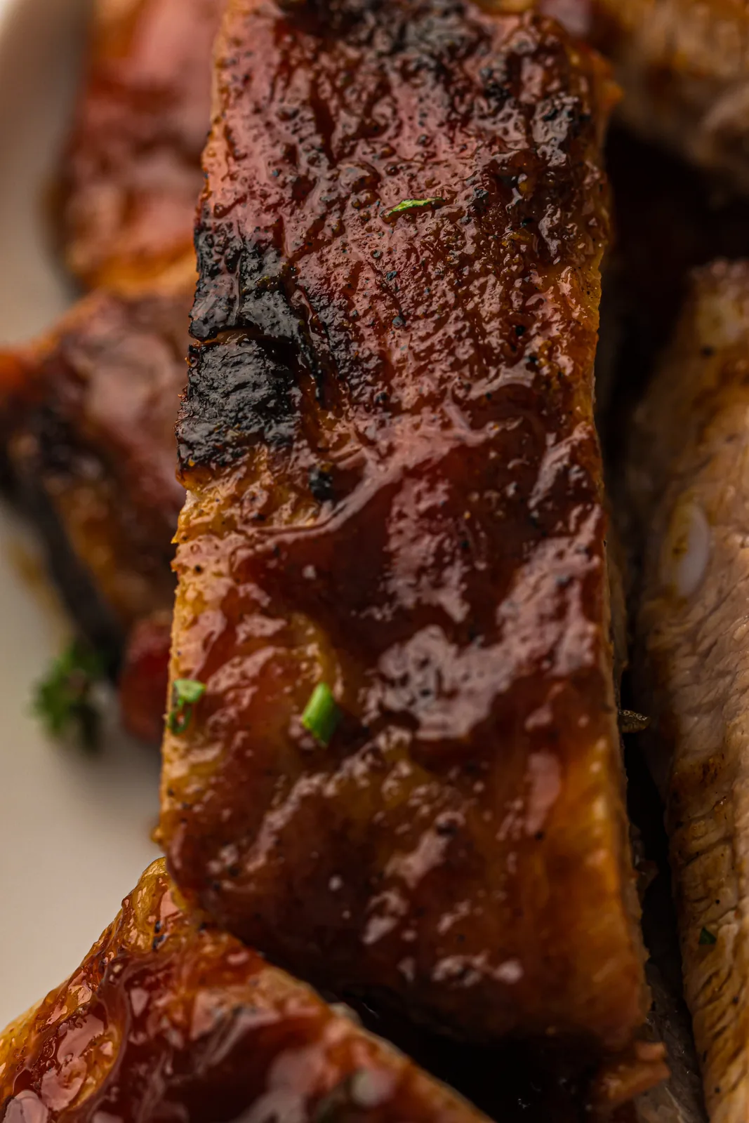 Sliced barbecue pork stacked on a board