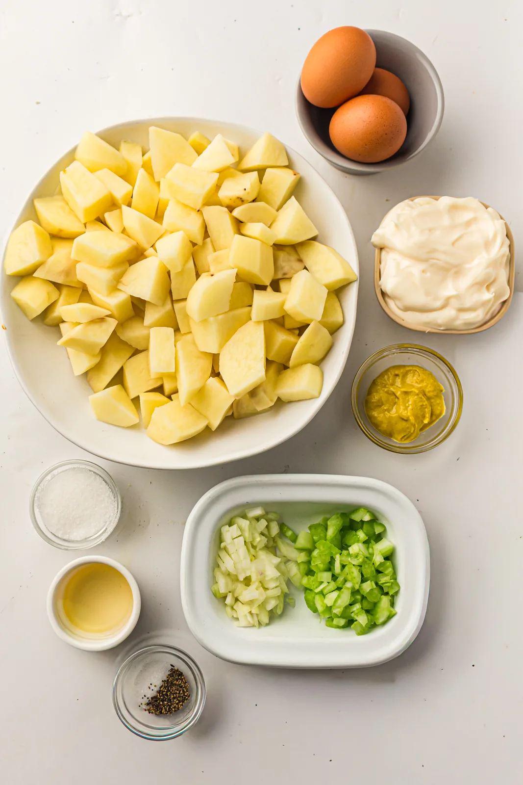 Ingredients for classic potato salad: potatoes, eggs and mayo