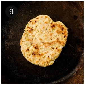A golden round cooking in a dry skillet