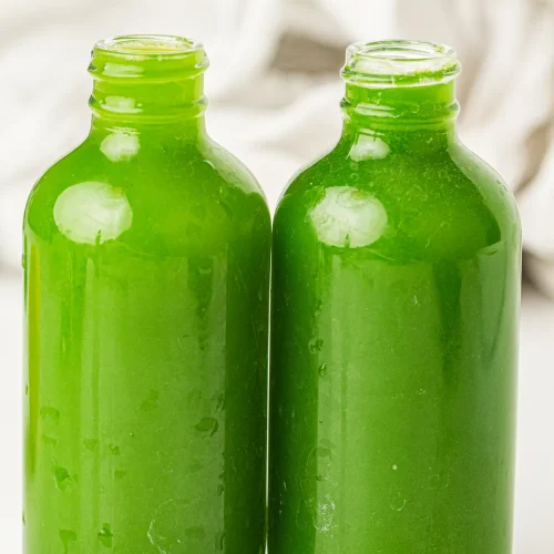Two bottles of homemade green juice from this green juice recipe