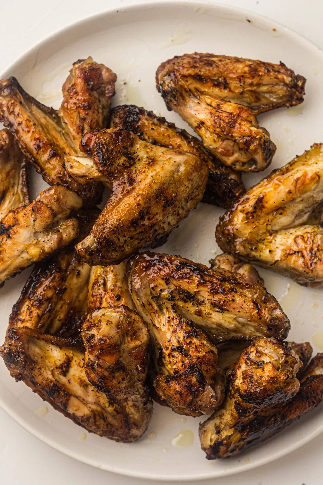 A platter of smoky, charred pieces with a dry rub, ready to serve