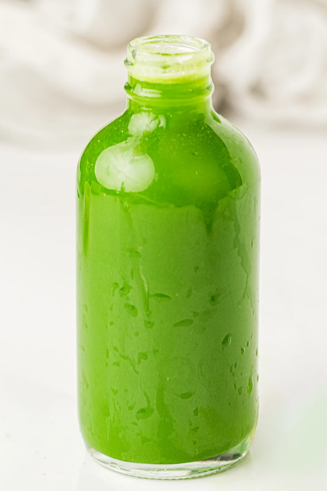 A single bottle of a healthy homemade vegetable drink
