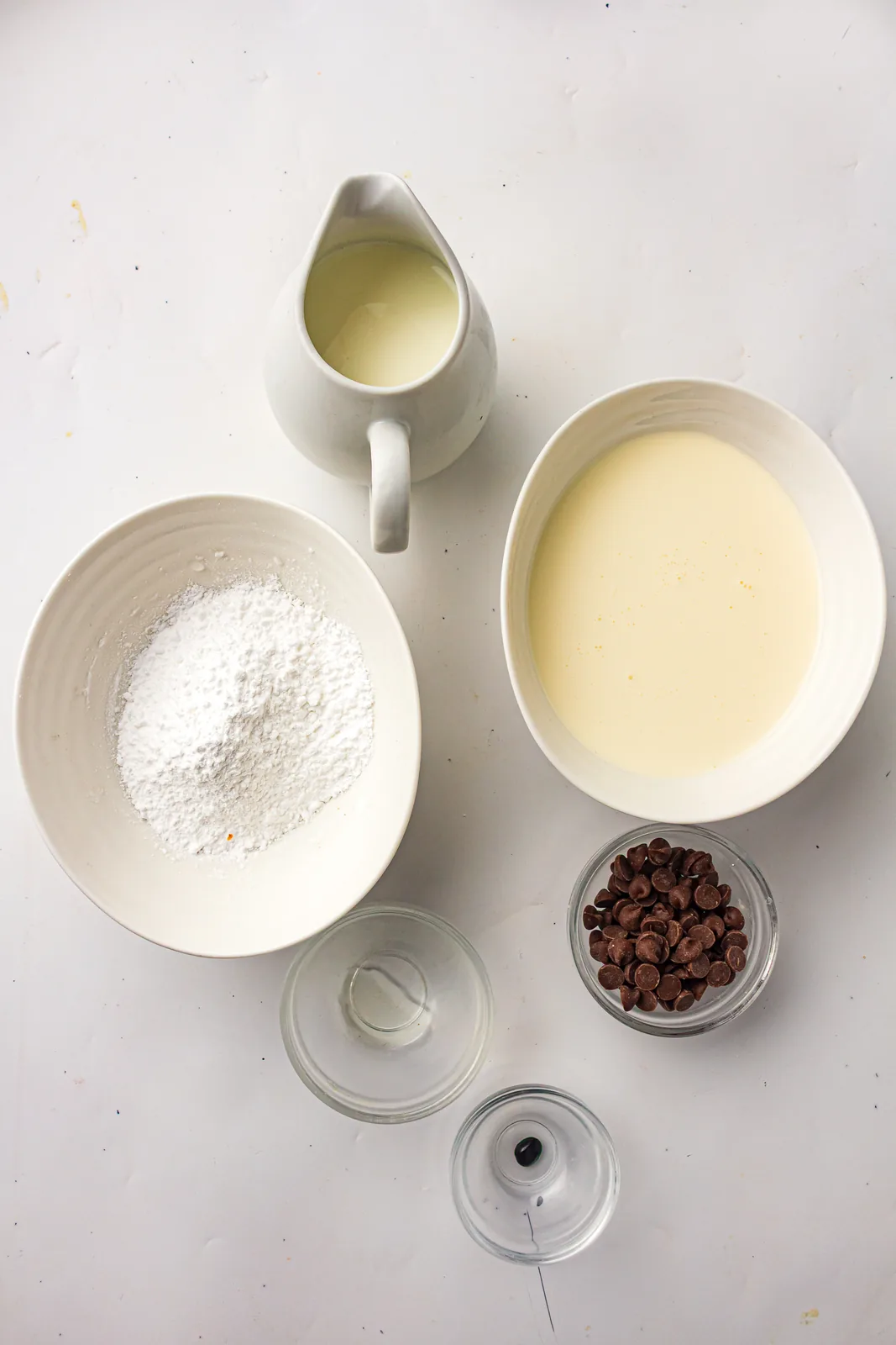 Ingredients for mint chocolate chip ice cream: milk, cream, sugar, peppermint, and chocolate chips