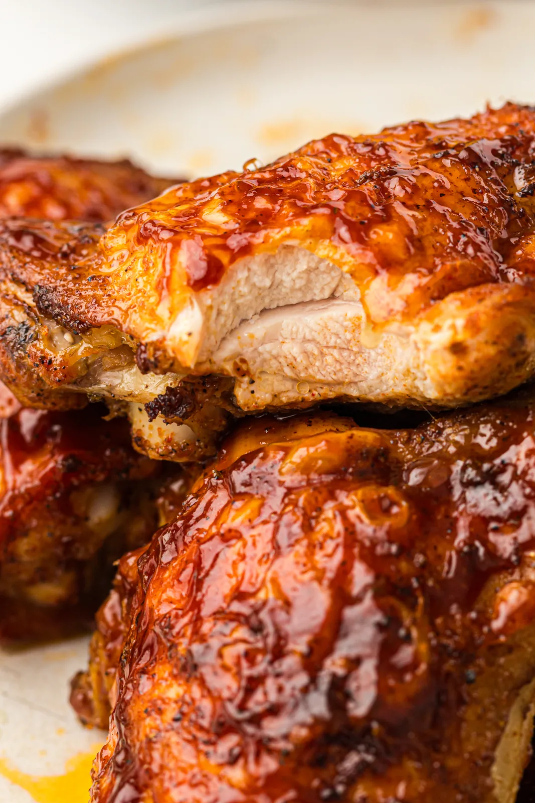 A platter of juicy, saucy dark meat garnished with fresh parsley