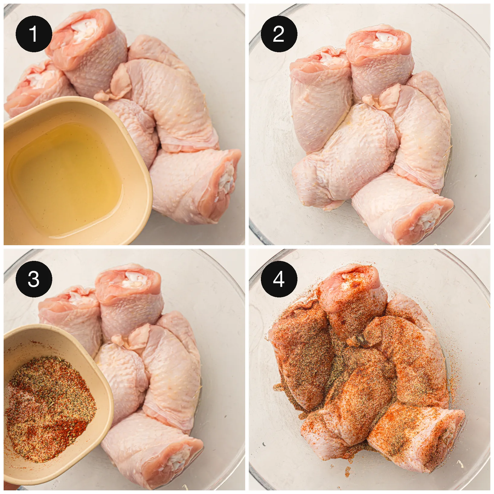 Bone-in poultry pieces tossed with oil and a paprika spice rub in a glass bowl