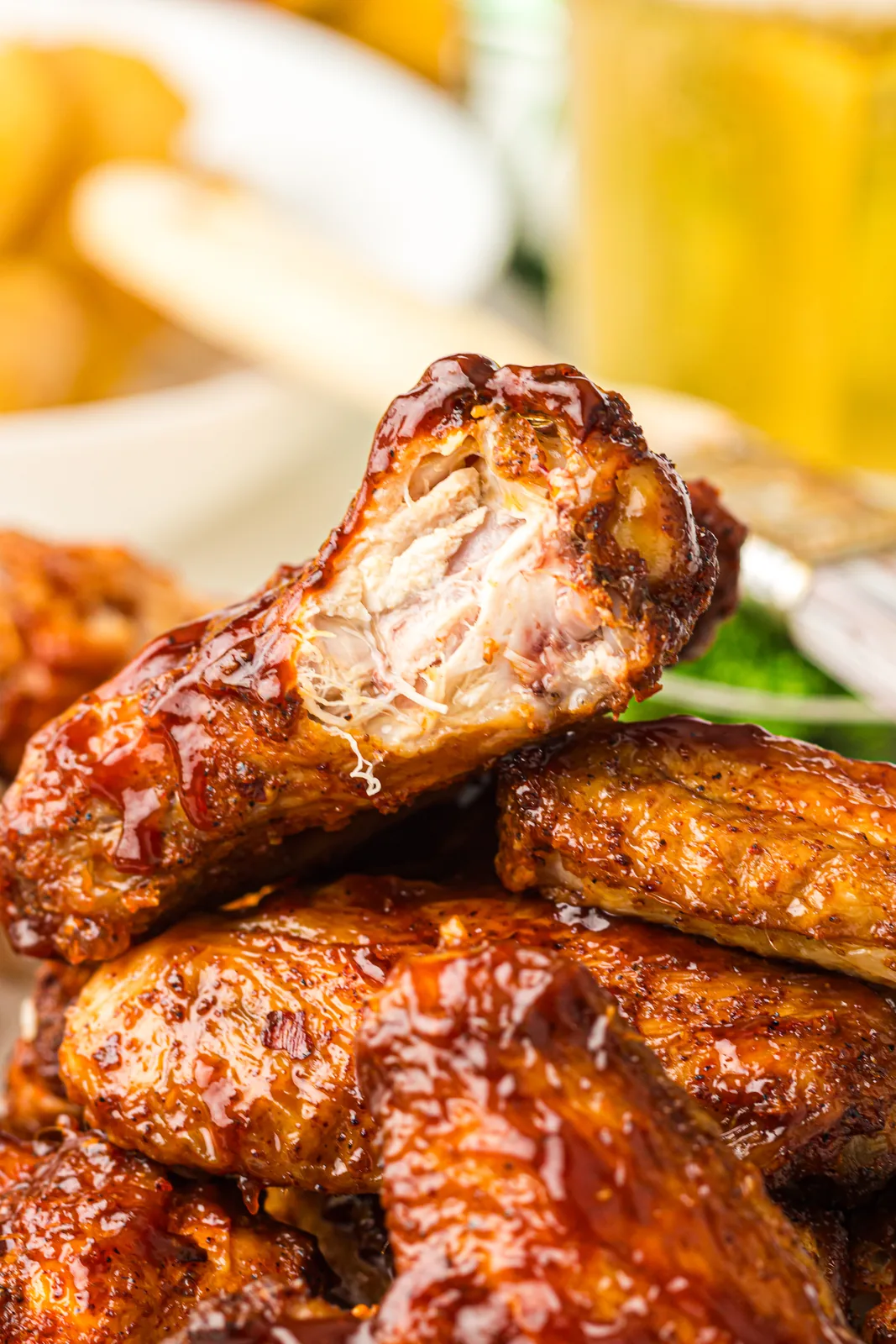 Sticky, glossy BBQ-glazed pieces piled on a platter