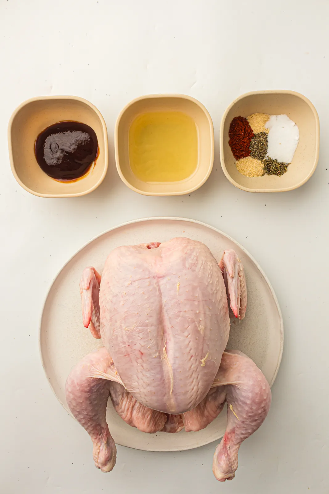 Ingredients for smoked whole chicken with a paprika rub and BBQ sauce