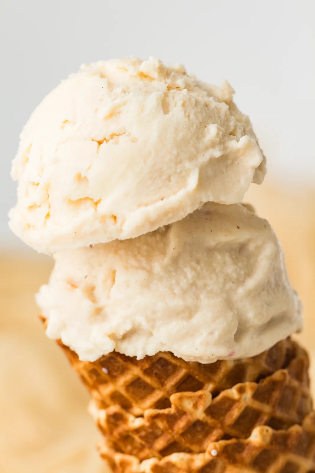High protein vanilla ice cream stacked on a waffle cone