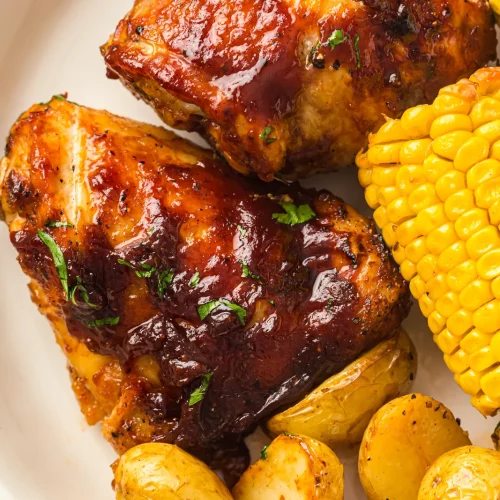 Sheet pan BBQ chicken thighs with corn and baby potatoes