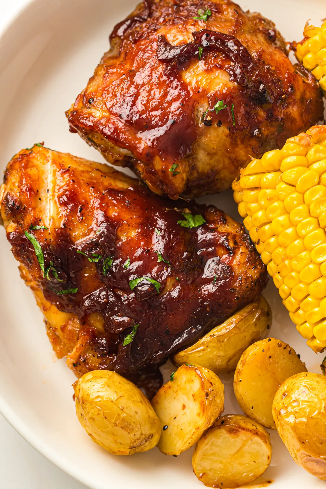 Sheet pan BBQ chicken thighs with corn and baby potatoes