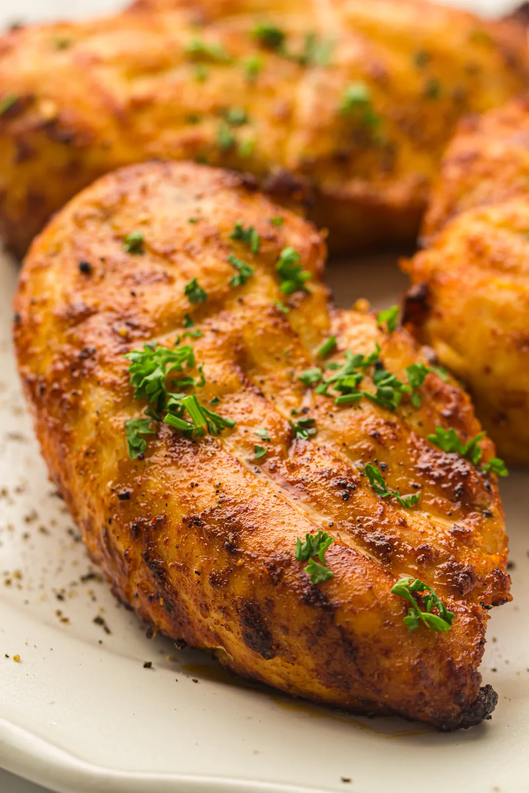 Air fryer chicken breast sliced open showing a juicy interior
