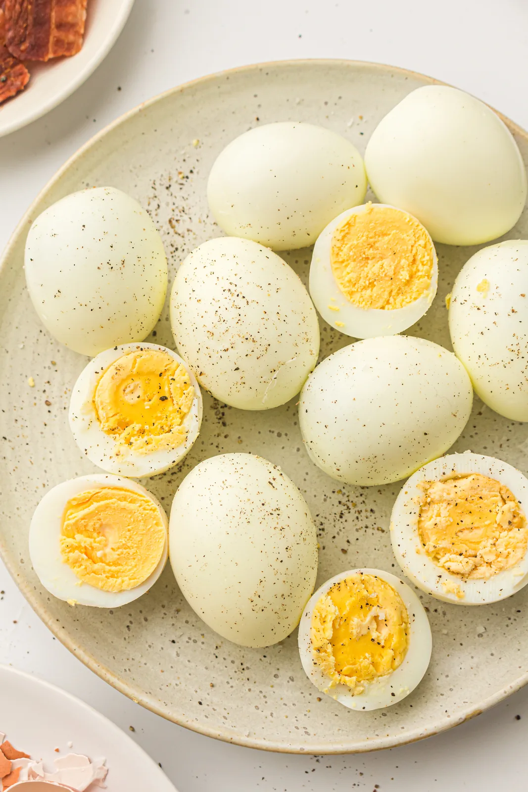 Halved egg showing a bright yellow set yolk