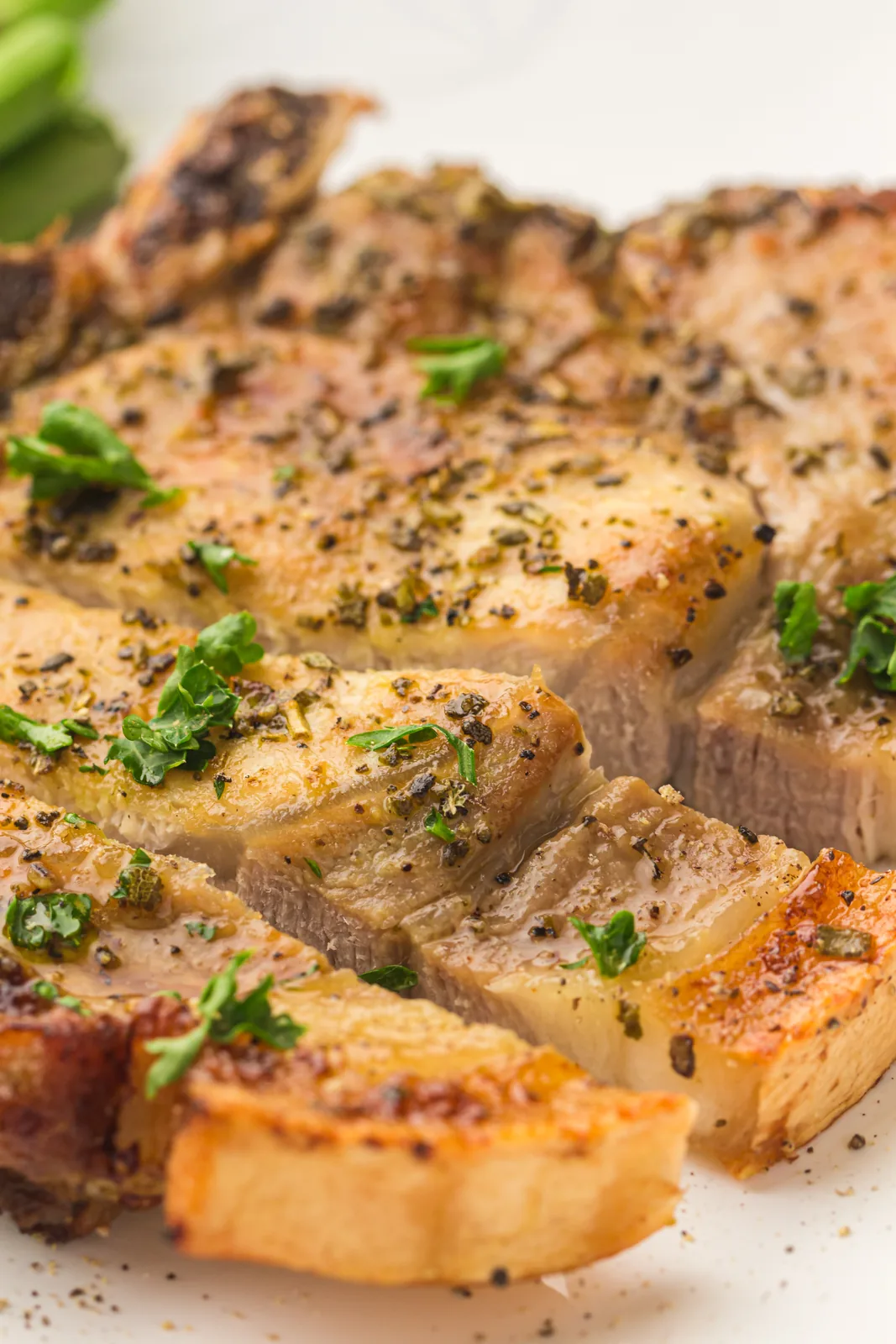 Sliced chop showing a juicy interior with a browned crust