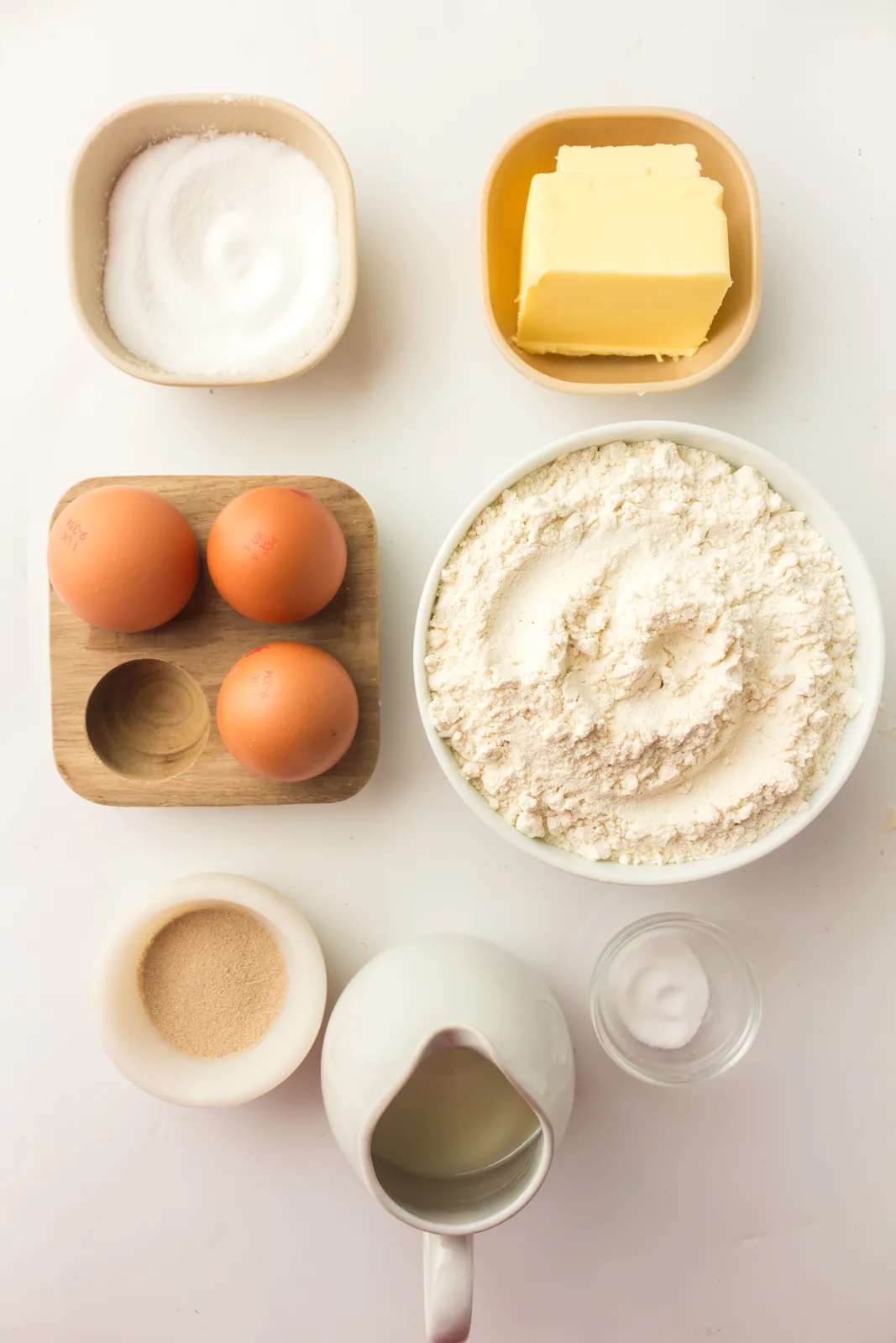 Ingredients for bread machine brioche: bread flour, eggs, butter, milk, sugar, salt and yeast