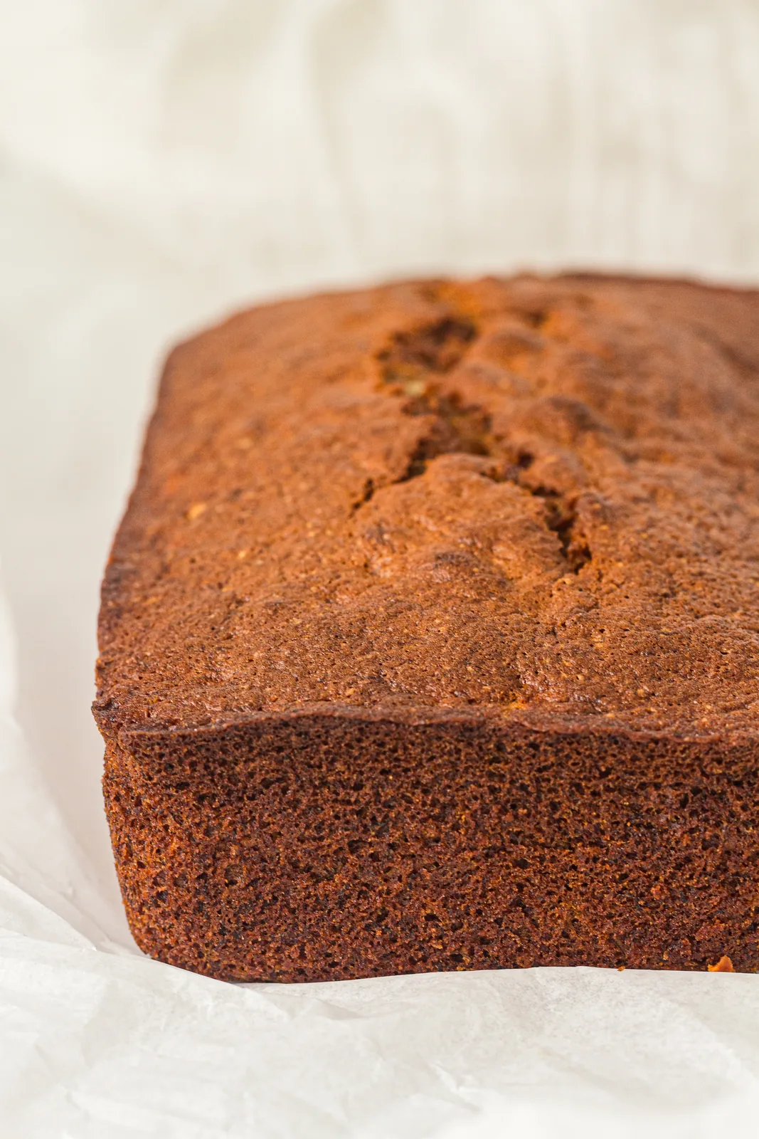 Gluten free banana bread loaf sliced to show the moist crumb