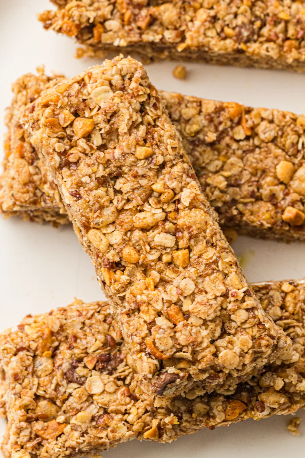 Homemade granola bars stacked showing the oats and nuts