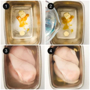 Raw chicken breasts submerged in a salty brine with crushed garlic