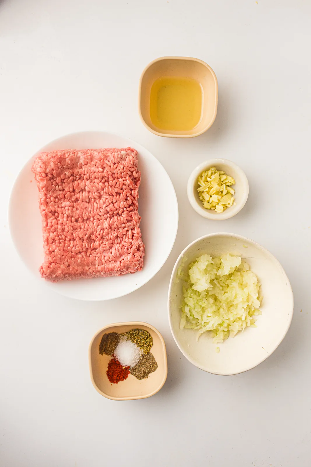 Ingredients for doner kebab: ground lamb, grated onion, minced garlic, paprika, cumin, oregano and olive oil