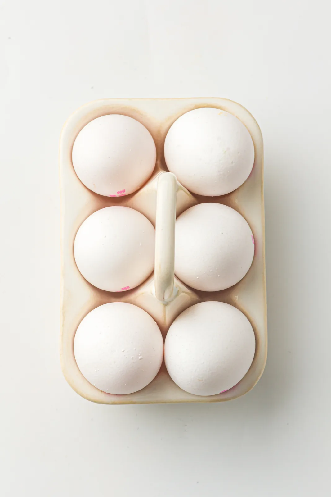 Ingredients for instant pot hard boiled eggs: six large white eggs in a carton