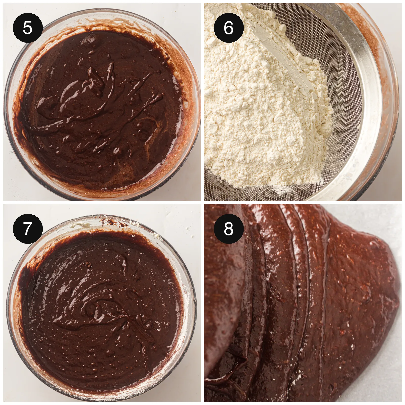Glossy dark batter in a glass bowl with flour sifted over the top ready to fold