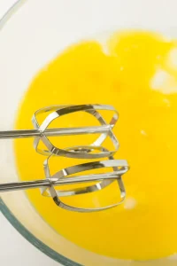 Eggs, melted butter and buttermilk whisked together into a pale yellow liquid