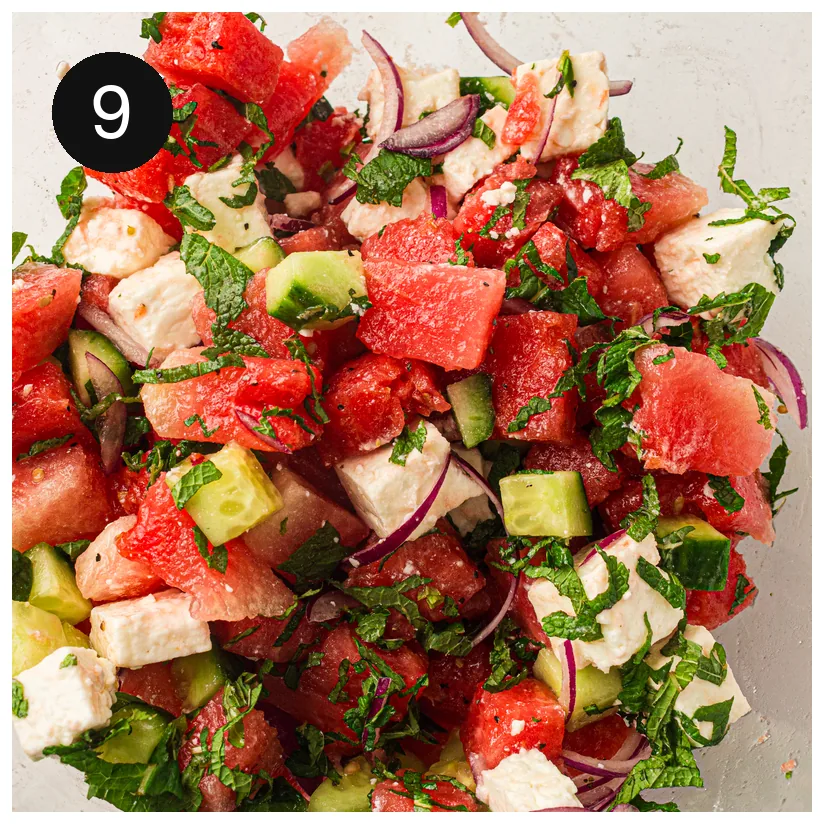 Cubes of white cheese and sliced herbs folded gently through the fruit