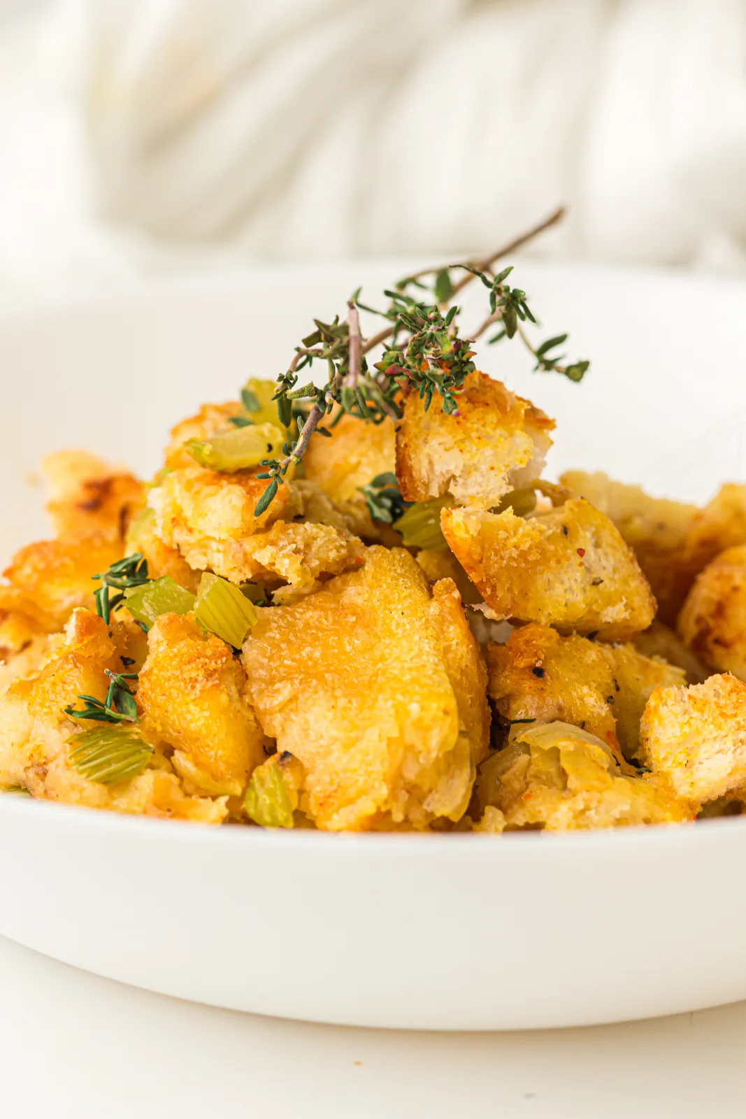 A bowlful topped with fresh thyme sprigs