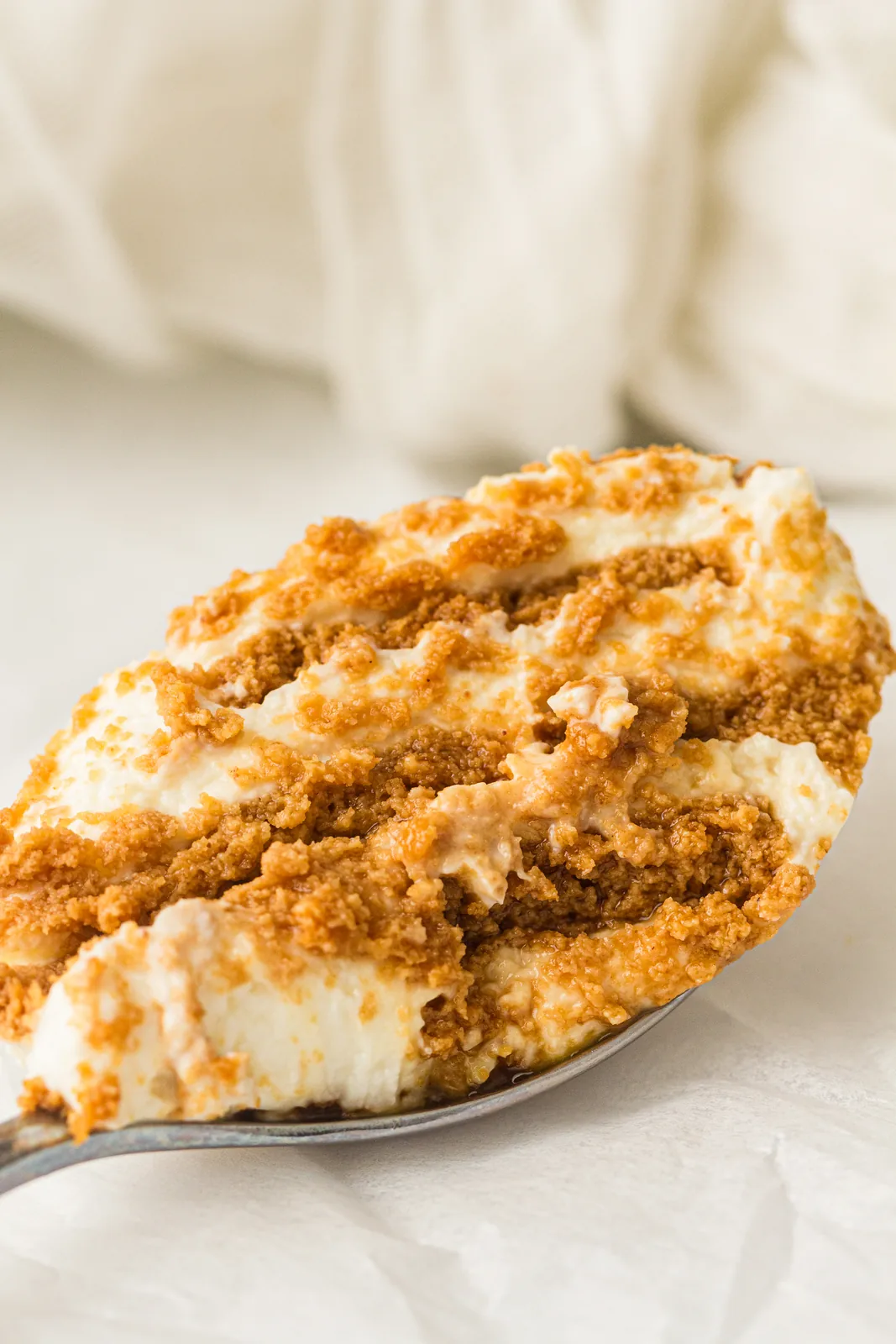 A spoonful showing the soft alternating layers after a night in the fridge