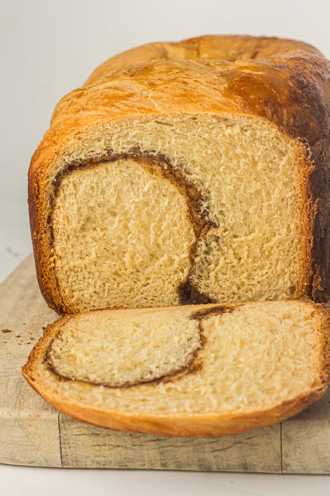 Bread machine cinnamon bread sliced open to show the cinnamon spiral inside