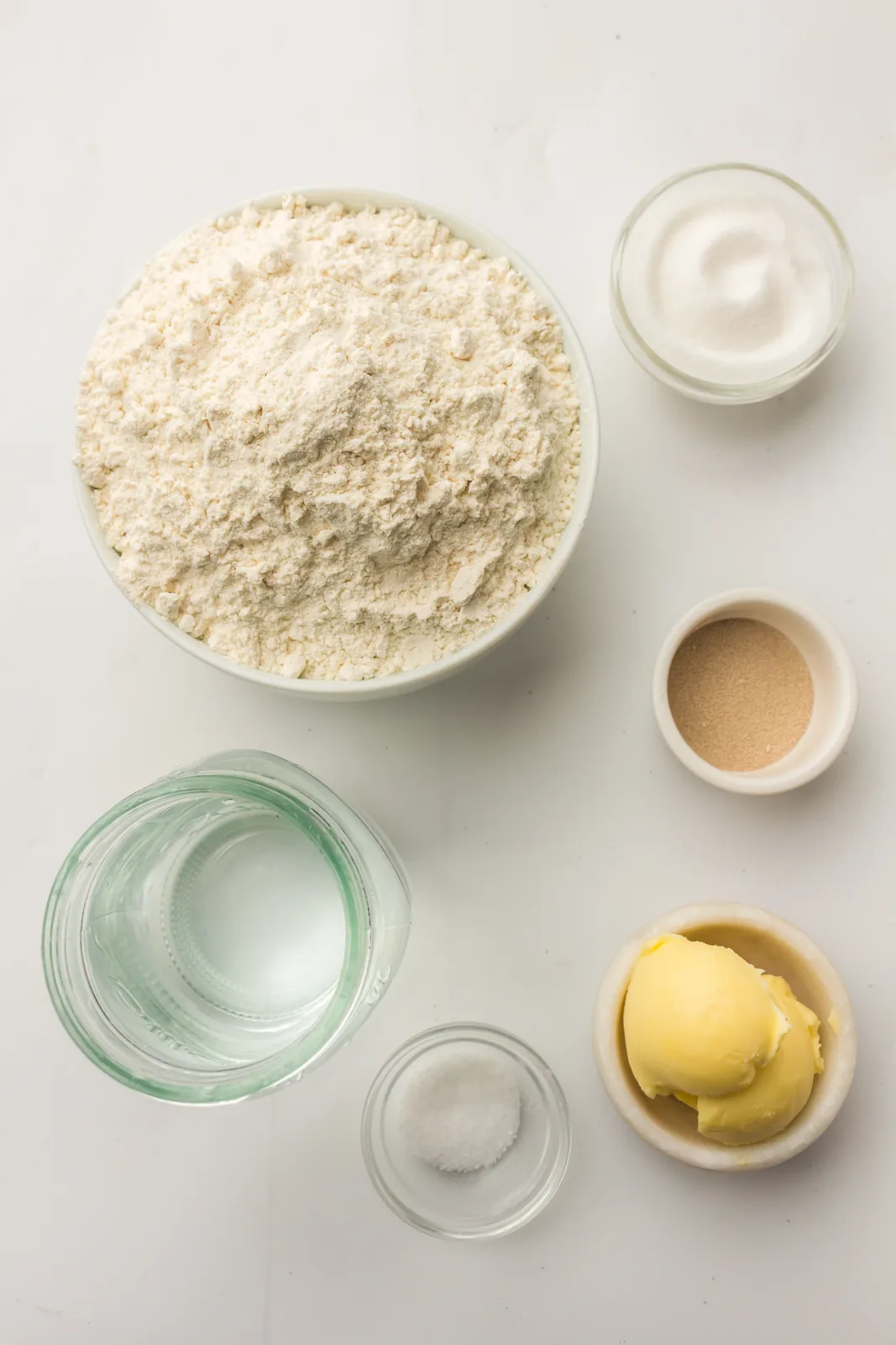 Ingredients for bread machine white bread: strong flour, water, butter, sugar, salt and yeast