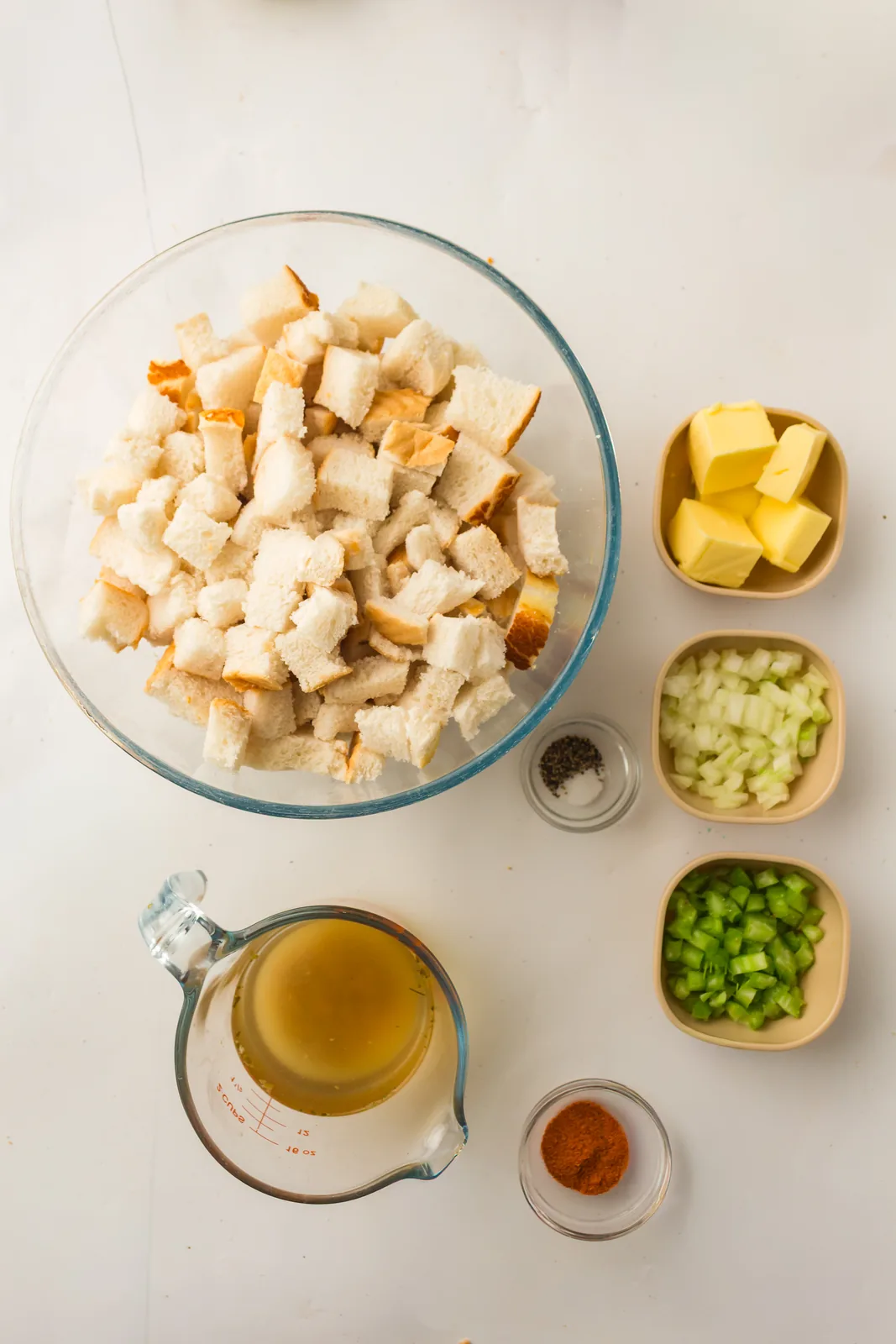 Ingredients for bread stuffing: cubed loaf, butter, onion, celery and stock