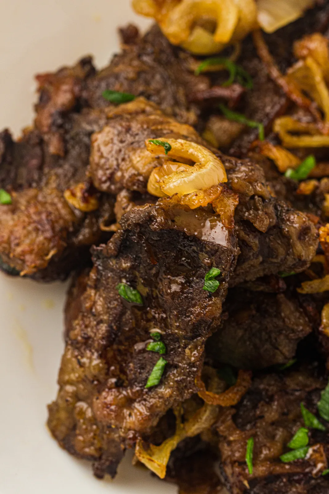 Golden fried rings piled over browned, crisp-edged slices