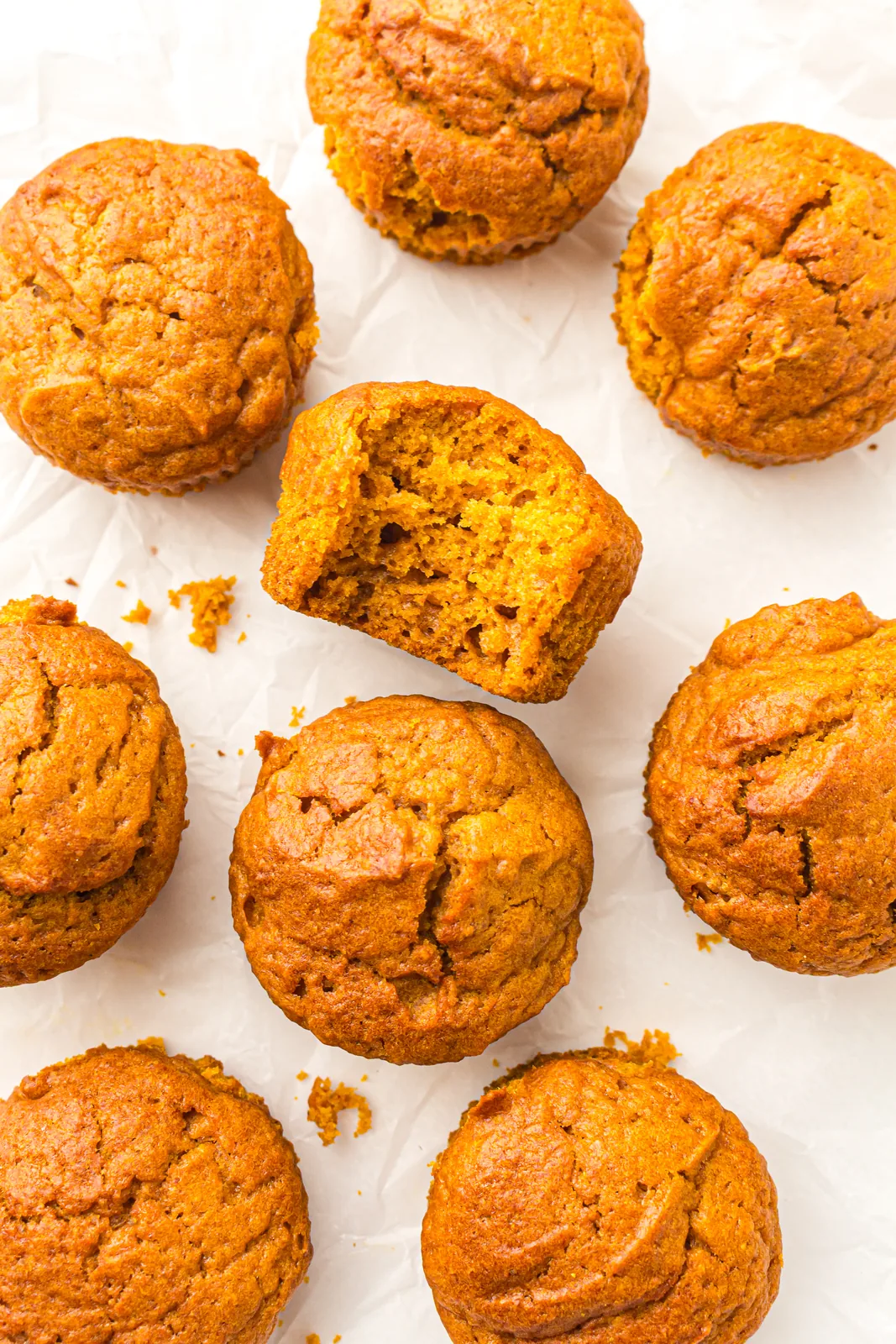 A tray of golden bakes cooling on a sheet of parchment