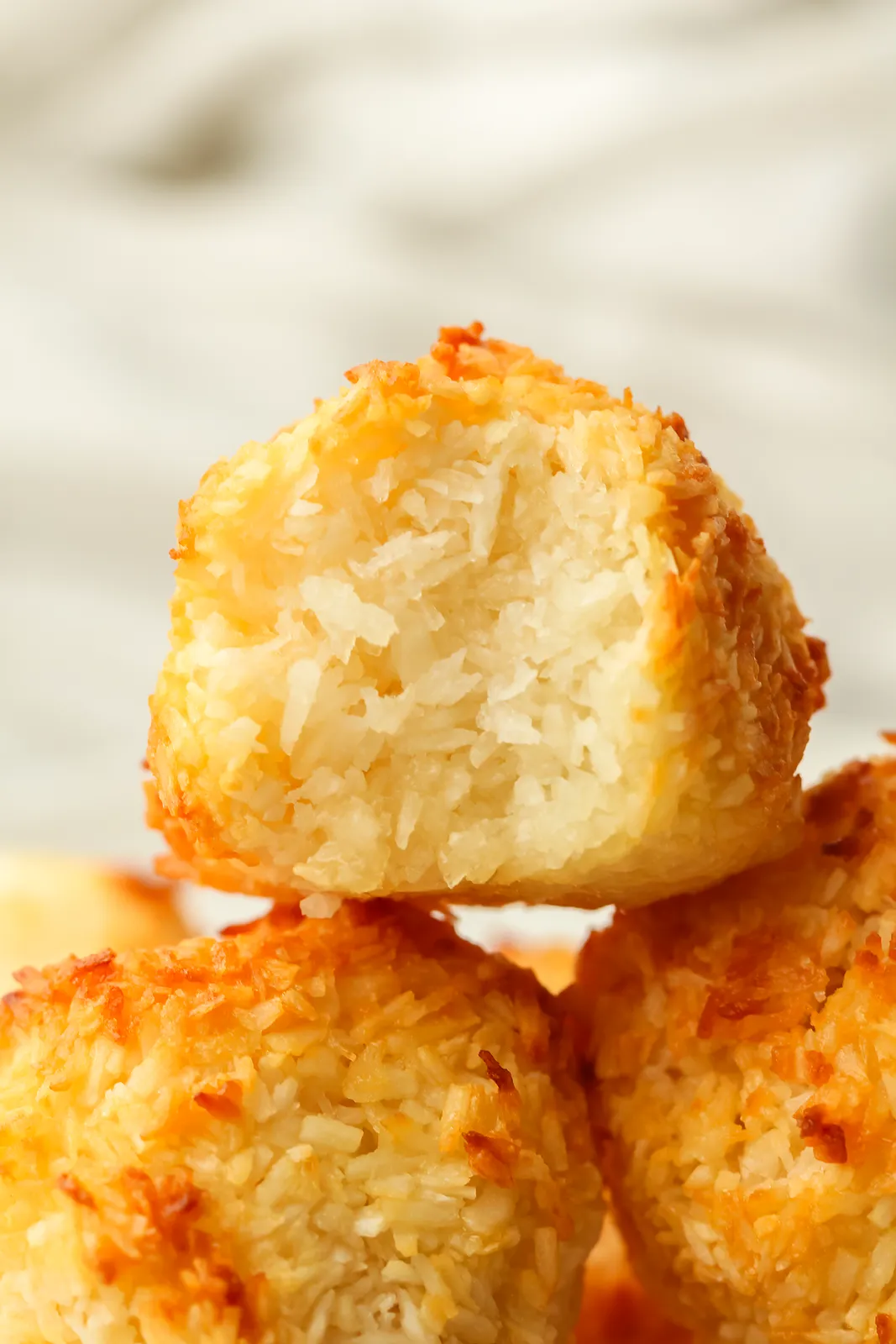 Close up of a bitten mound showing the soft, chewy centre