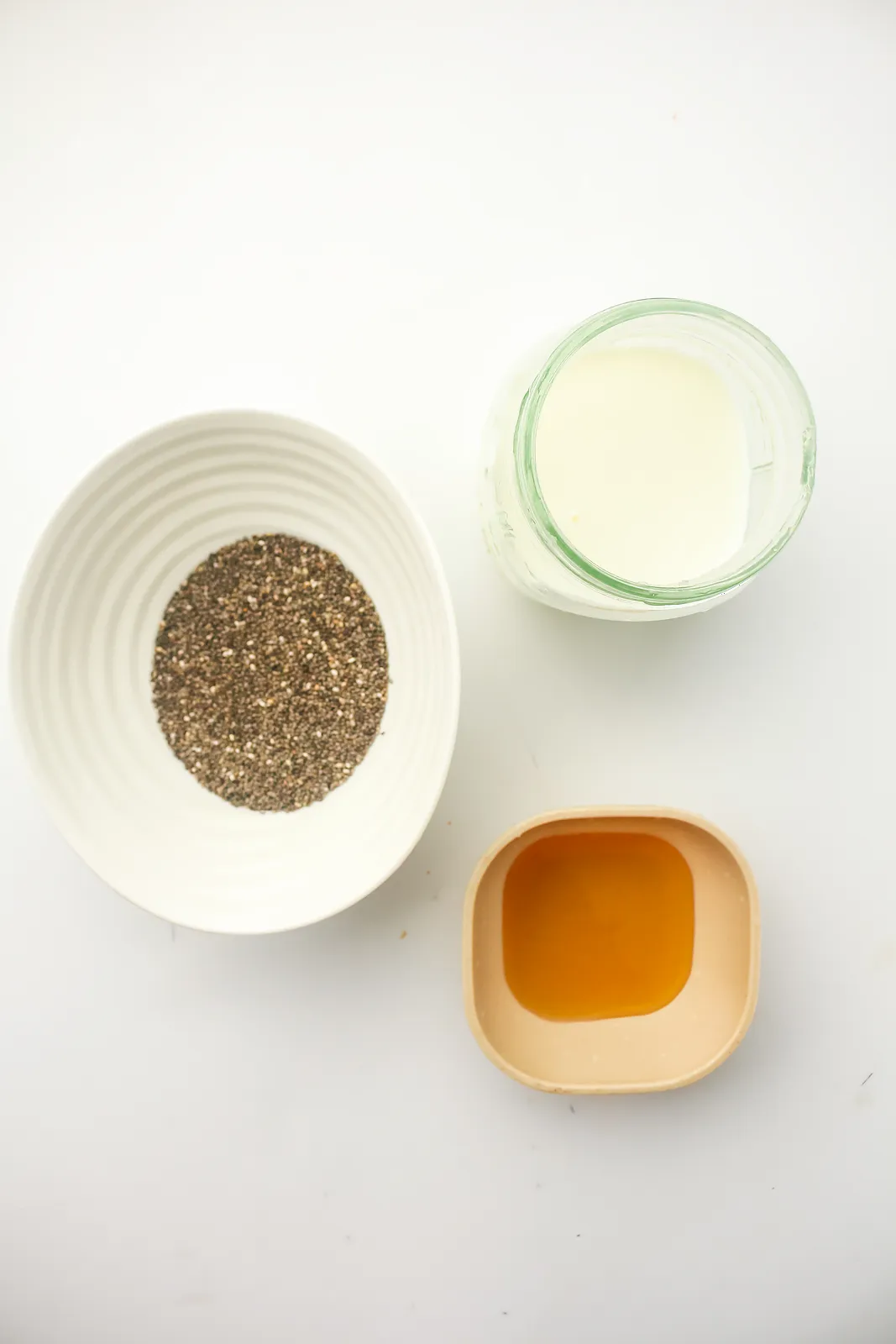 Ingredients for chia pudding: chia seeds, milk and honey