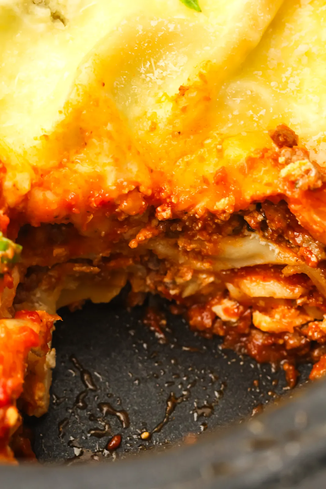 Close up of the beef ragu and pasta layers inside the pot after a slice was lifted out