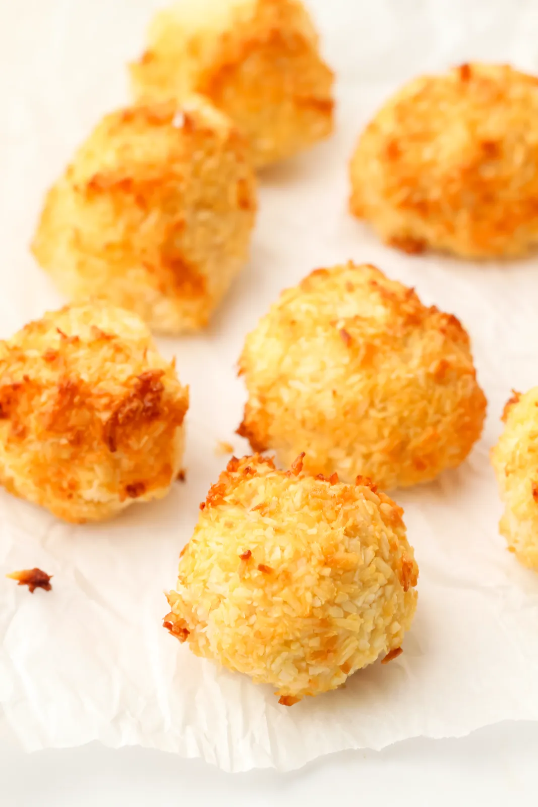 Toasted golden mounds scattered on crinkled baking paper